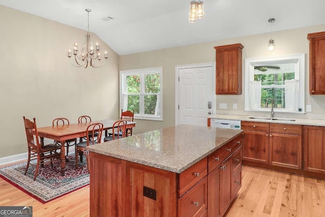 220 Candleberry Way, Guyton, GA 31312 - kitchen featuring a sink, light wood-style flooring, a kitchen island, dishwasher, and a chandelier