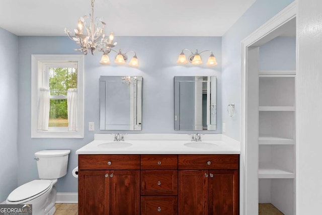 220 Candleberry Way, Guyton, GA 31312 - full bath with double vanity, a chandelier, toilet, and built in shelves