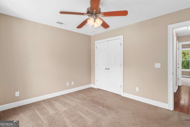 220 Candleberry Way, Guyton, GA 31312 - unfurnished bedroom featuring baseboards, a closet, and carpet flooring