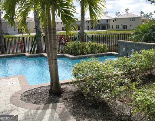 view of pool with a fenced backyard