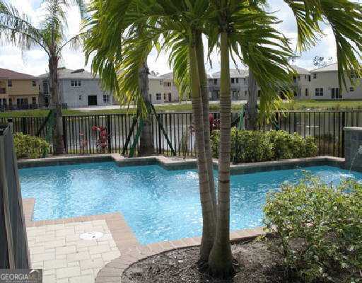 view of swimming pool with a fenced backyard