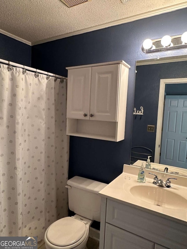 304 Joshua Tree Dr Unit 304, Augusta, GA 30907 - bathroom featuring ornamental molding, toilet, vanity, a textured ceiling, and a shower with curtain