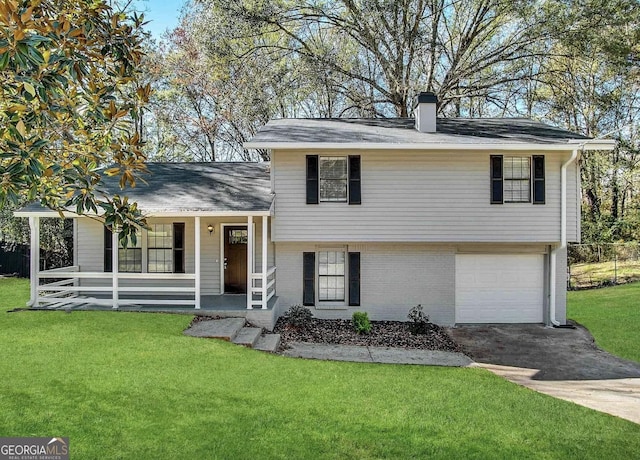 3879 Mcgill Ln, Decatur, GA 30034 - tri-level home featuring a porch, concrete driveway, a front yard, brick siding, and an attached garage