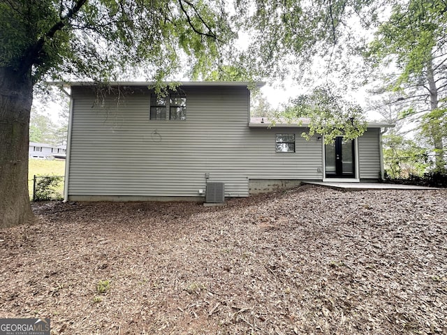 3879 Mcgill Ln, Decatur, GA 30034 - back of property featuring central AC and a patio