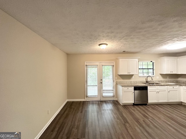 3879 Mcgill Ln, Decatur, GA 30034 - kitchen with dishwasher, baseboards, dark wood-style floors, a sink, and white cabinets