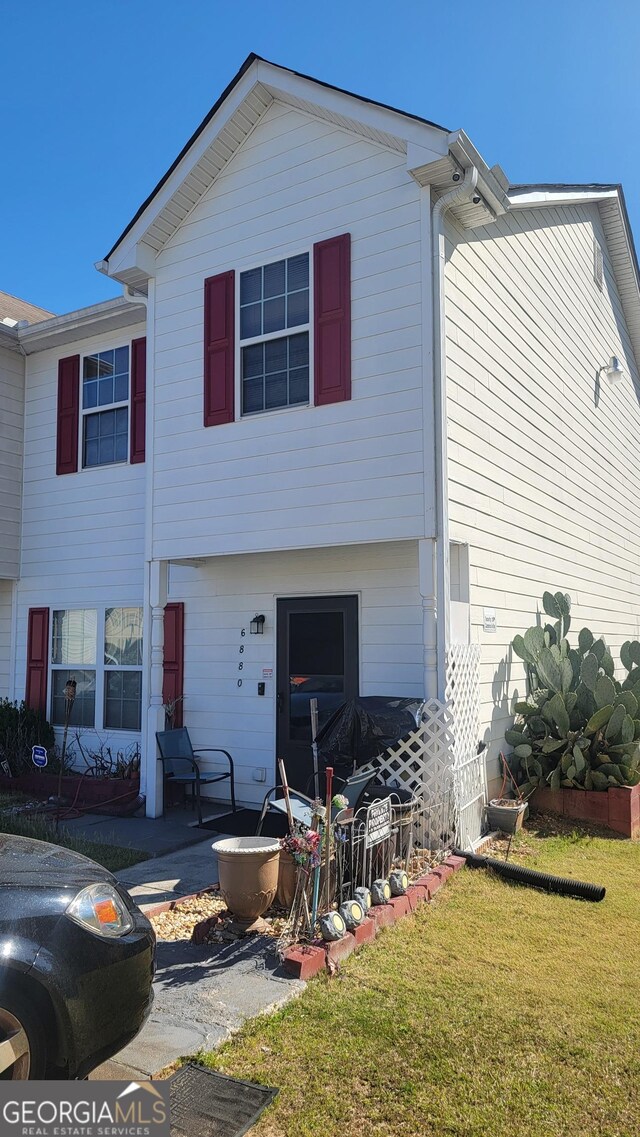 6880 Mountain Cir, Riverdale, GA 30274 - back of house featuring a yard