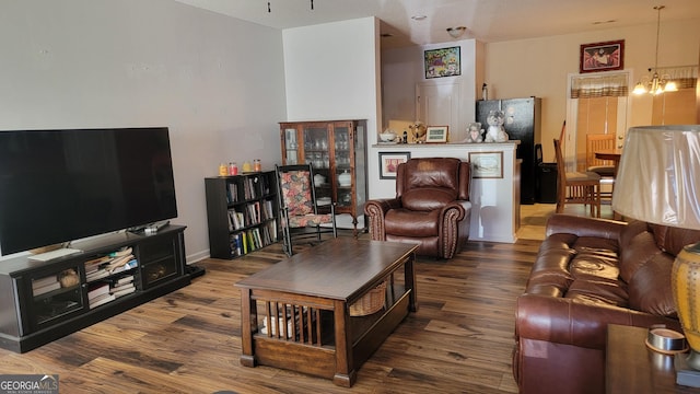 6880 Mountain Cir, Riverdale, GA 30274 - living area featuring wood finished floors and a chandelier