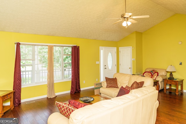 living area with hardwood / wood-style floors, lofted ceiling, ceiling fan, baseboards, and a textured ceiling