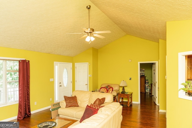 living area with wood finished floors, a textured ceiling, lofted ceiling, ceiling fan, and baseboards