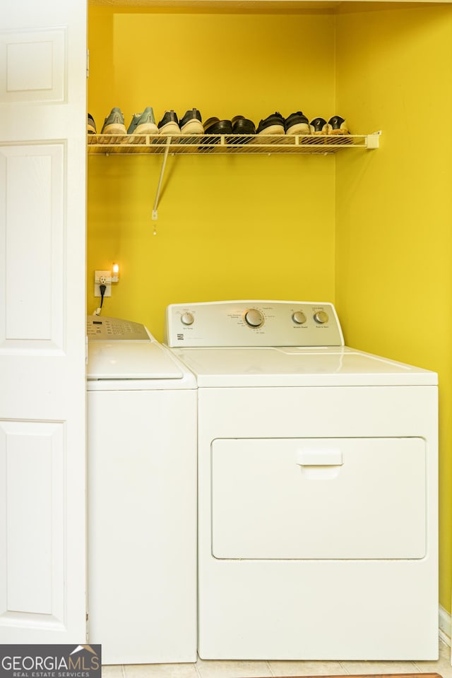 laundry area with separate washer and dryer