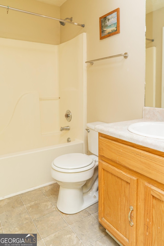 full bath featuring toilet,  shower combination, vanity, and tile patterned floors