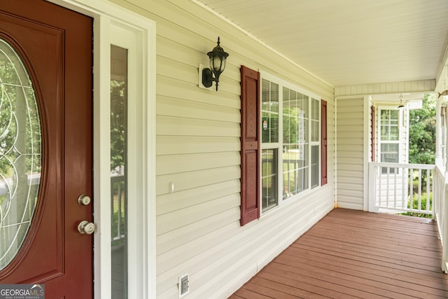 view of exterior entry featuring a porch