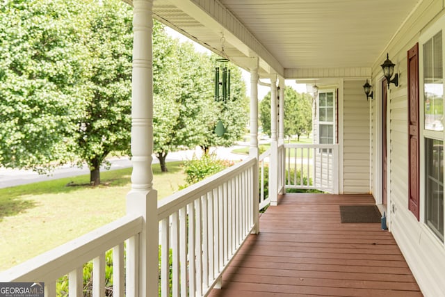 wooden terrace with a porch