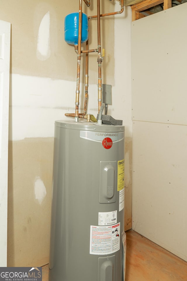 utility room featuring water heater