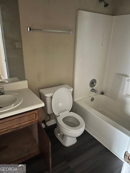 432 Manor Estates Dr, Stockbridge, GA 30281 - full bath featuring tub / shower combination, vanity, and wood finished floors