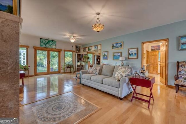 275 Everetts Vw, Blairsville, GA 30512 - living area with french doors, wood finished floors, a chandelier, and baseboards