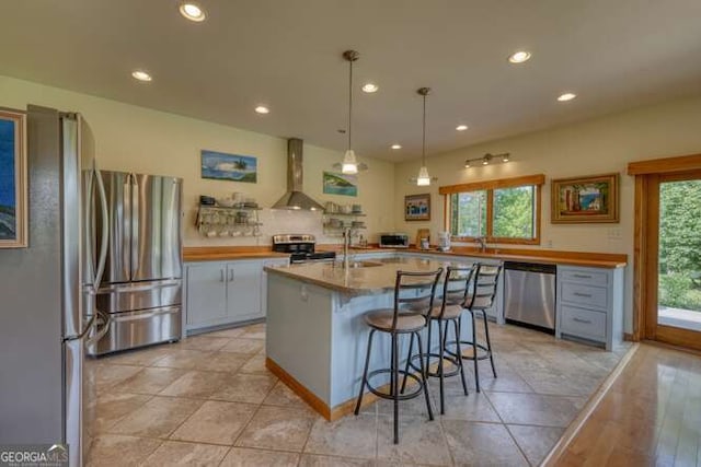 275 Everetts Vw, Blairsville, GA 30512 - kitchen with stainless steel appliances, plenty of natural light, wall chimney exhaust hood, recessed lighting, and a breakfast bar area