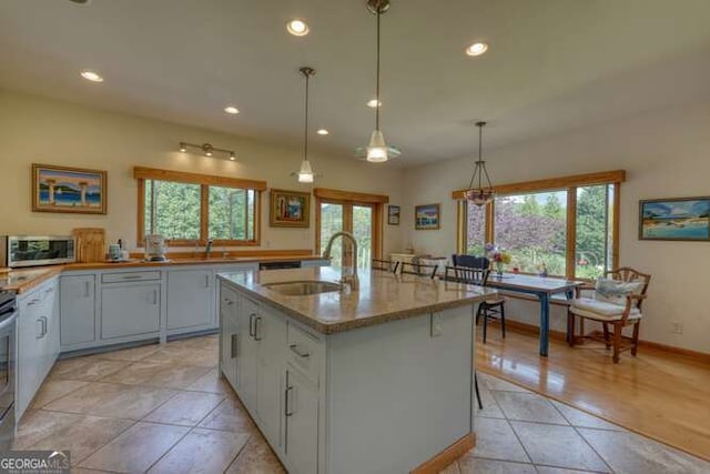 275 Everetts Vw, Blairsville, GA 30512 - kitchen with a sink, healthy amount of natural light, recessed lighting, light tile patterned floors, and light stone counters