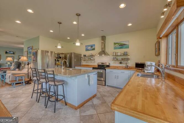 275 Everetts Vw, Blairsville, GA 30512 - kitchen featuring appliances with stainless steel finishes, wall chimney range hood, a sink, recessed lighting, and a breakfast bar area