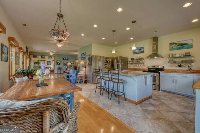 275 Everetts Vw, Blairsville, GA 30512 - kitchen featuring stainless steel appliances, wall chimney exhaust hood, hanging light fixtures, ceiling fan, and recessed lighting