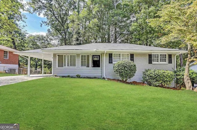 2651 Lois Ln SE, Atlanta, GA 30315 - ranch-style house with driveway, a front lawn, and a carport