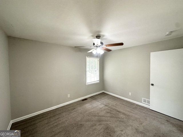 2651 Lois Ln SE, Atlanta, GA 30315 - empty room featuring ceiling fan, baseboards, and dark colored carpet