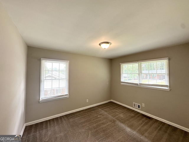 2651 Lois Ln SE, Atlanta, GA 30315 - unfurnished room with baseboards and dark colored carpet