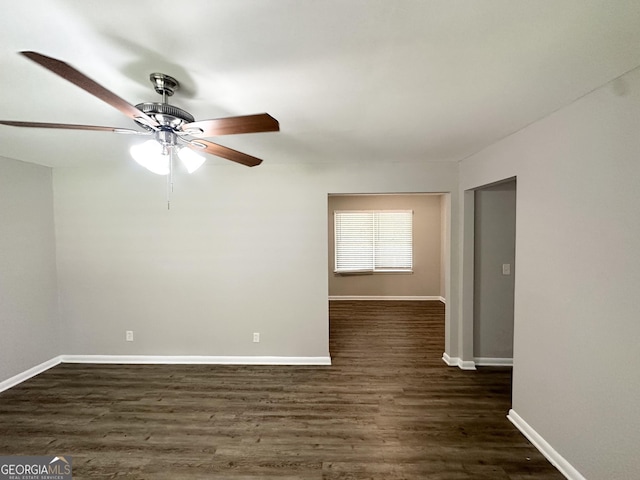 2651 Lois Ln SE, Atlanta, GA 30315 - empty room with a ceiling fan, dark wood finished floors, and baseboards