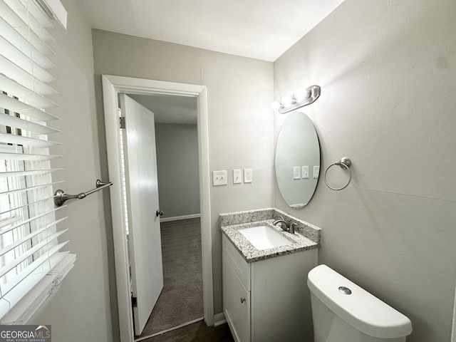 2651 Lois Ln SE, Atlanta, GA 30315 - half bathroom featuring vanity and toilet