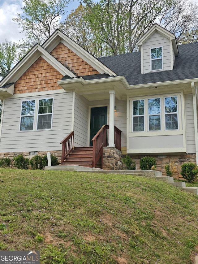 4075 SW Fairburn Ave SW, Atlanta, GA 30331 - view of front of house with a front yard, a shingled roof, and crawl space