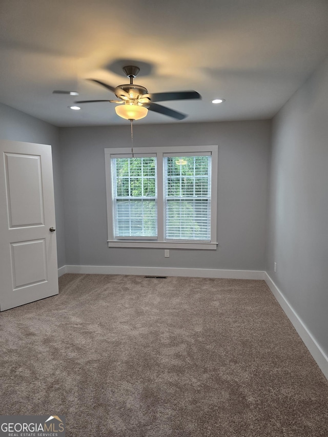 4075 SW Fairburn Ave SW, Atlanta, GA 30331 - carpeted empty room featuring a ceiling fan and recessed lighting