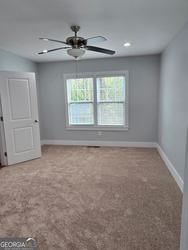 4075 SW Fairburn Ave SW, Atlanta, GA 30331 - carpeted spare room with a ceiling fan and recessed lighting