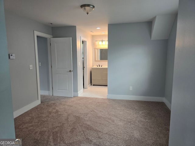4075 SW Fairburn Ave SW, Atlanta, GA 30331 - unfurnished bedroom featuring light colored carpet and connected bathroom