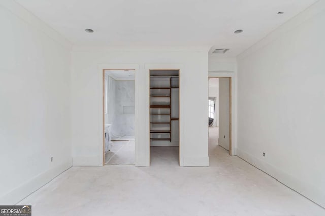 unfurnished bedroom with ornamental molding, ensuite bath, and baseboards