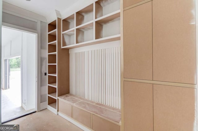 mudroom featuring unfinished concrete flooring