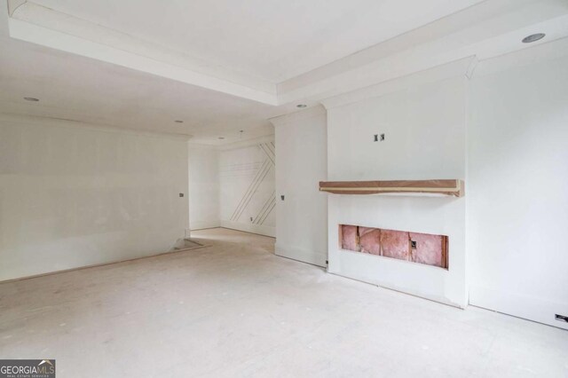 unfurnished living room featuring concrete floors