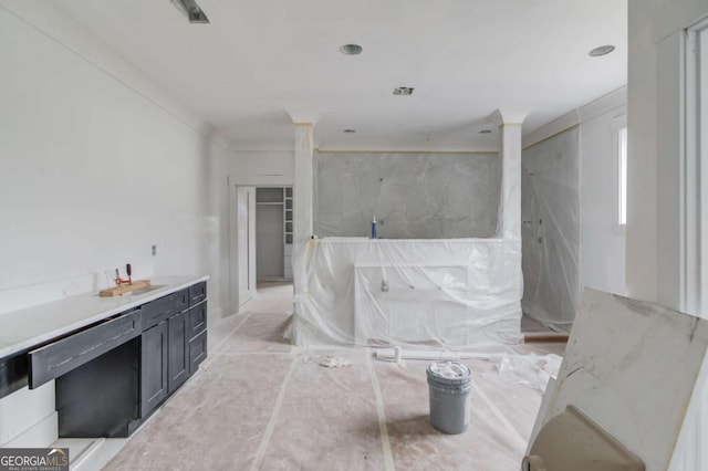 bathroom featuring a marble finish shower