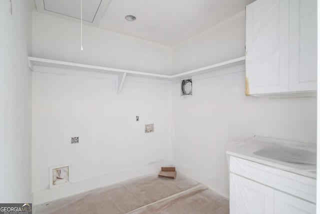 laundry area featuring attic access and washer hookup