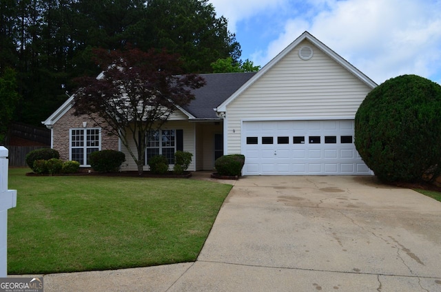 ranch-style home featuring a garage, concrete driveway, and a front lawn