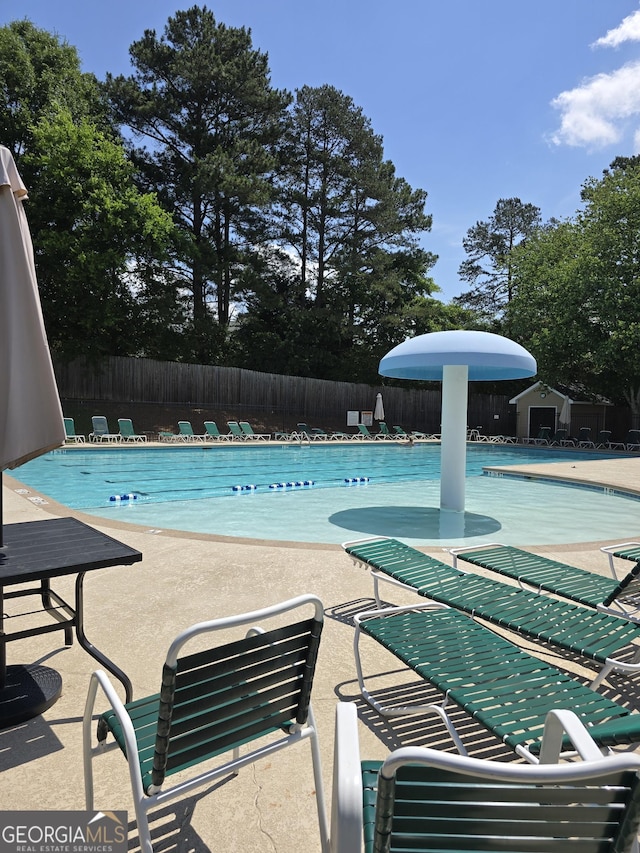 282 Ellesmere Ct, Buford, GA 30518 - community pool featuring a patio