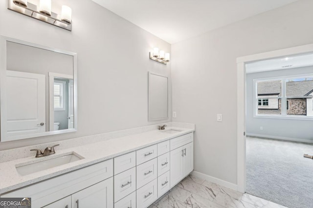 8210 Sonata Ln, Cumming, GA 30041 - full bath featuring toilet, double vanity, baseboards, and marble look tile flooring