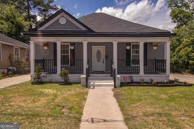 346 Grant Ave, Macon, GA 31201 - view of front of home with a porch, a shingled roof, and a front yard