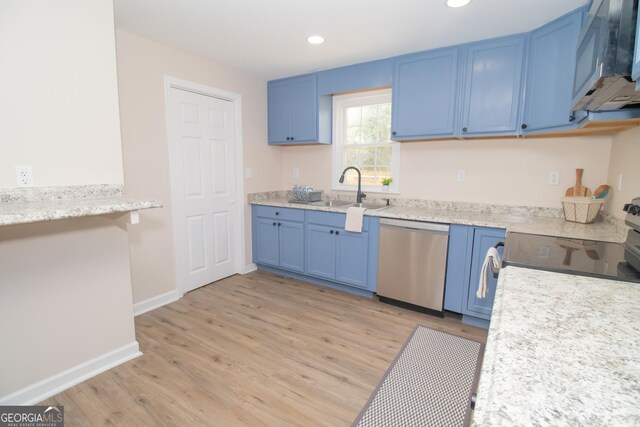 346 Grant Ave, Macon, GA 31201 - kitchen with stainless steel appliances, blue cabinetry, a sink, light wood-style floors, and recessed lighting