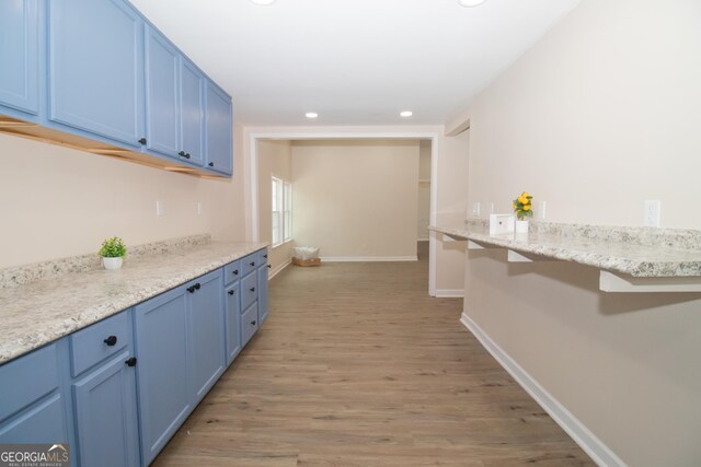 346 Grant Ave, Macon, GA 31201 - kitchen featuring blue cabinets, light wood-type flooring, recessed lighting, and baseboards