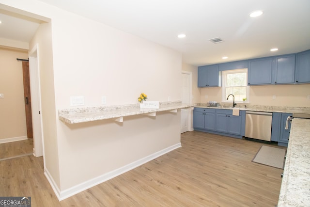 346 Grant Ave, Macon, GA 31201 - kitchen with stainless steel dishwasher, blue cabinets, light wood-style flooring, baseboards, and recessed lighting