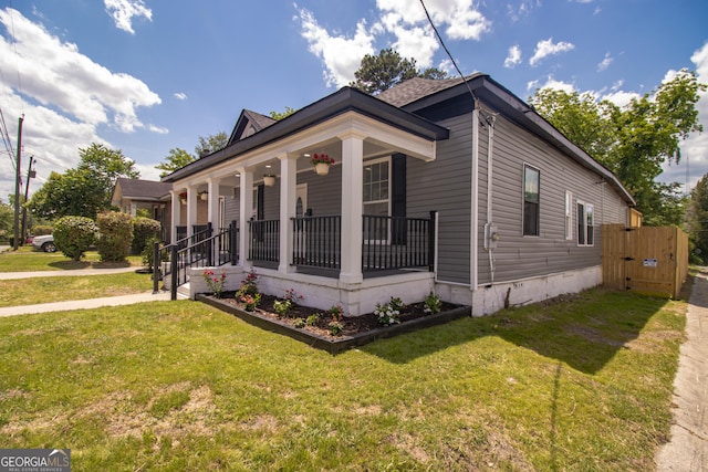 346 Grant Ave, Macon, GA 31201 - view of front of house with covered porch, a front yard, crawl space, and a gate