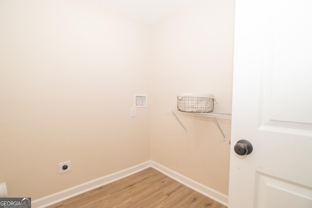 346 Grant Ave, Macon, GA 31201 - laundry room featuring electric dryer hookup, light wood-style flooring, and baseboards