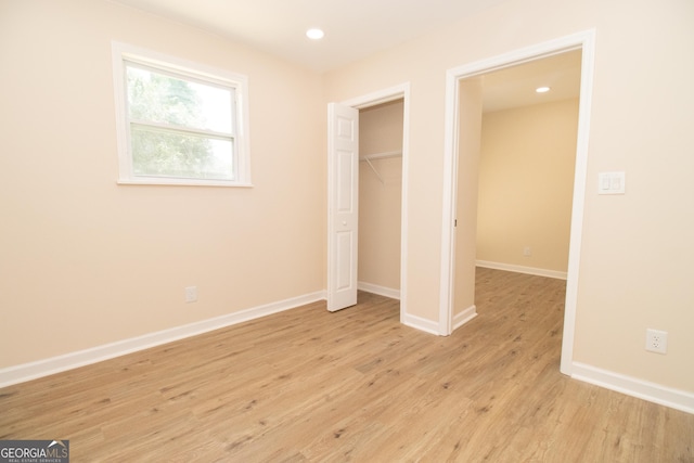 346 Grant Ave, Macon, GA 31201 - unfurnished bedroom with light wood-type flooring, baseboards, recessed lighting, and a closet