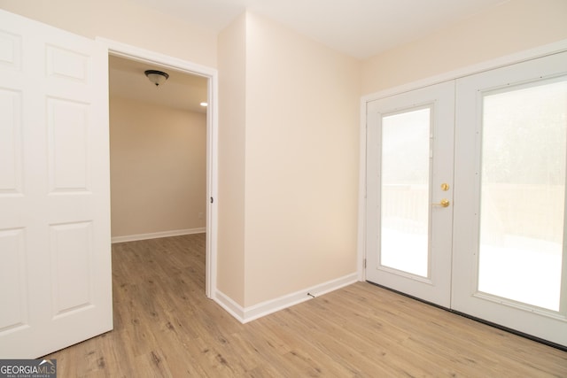 346 Grant Ave, Macon, GA 31201 - doorway with light wood-style flooring, french doors, and baseboards