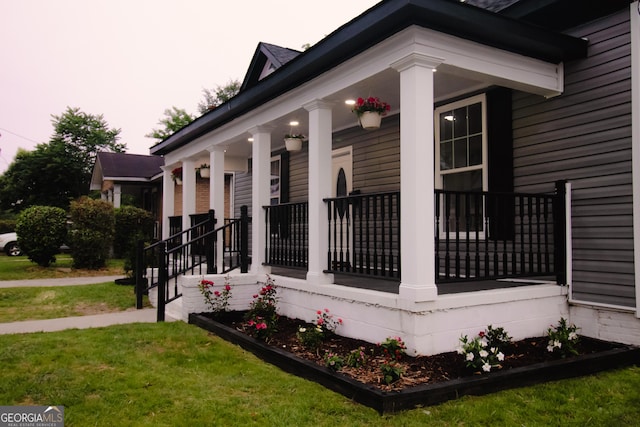 346 Grant Ave, Macon, GA 31201 - view of side of home featuring covered porch and a lawn